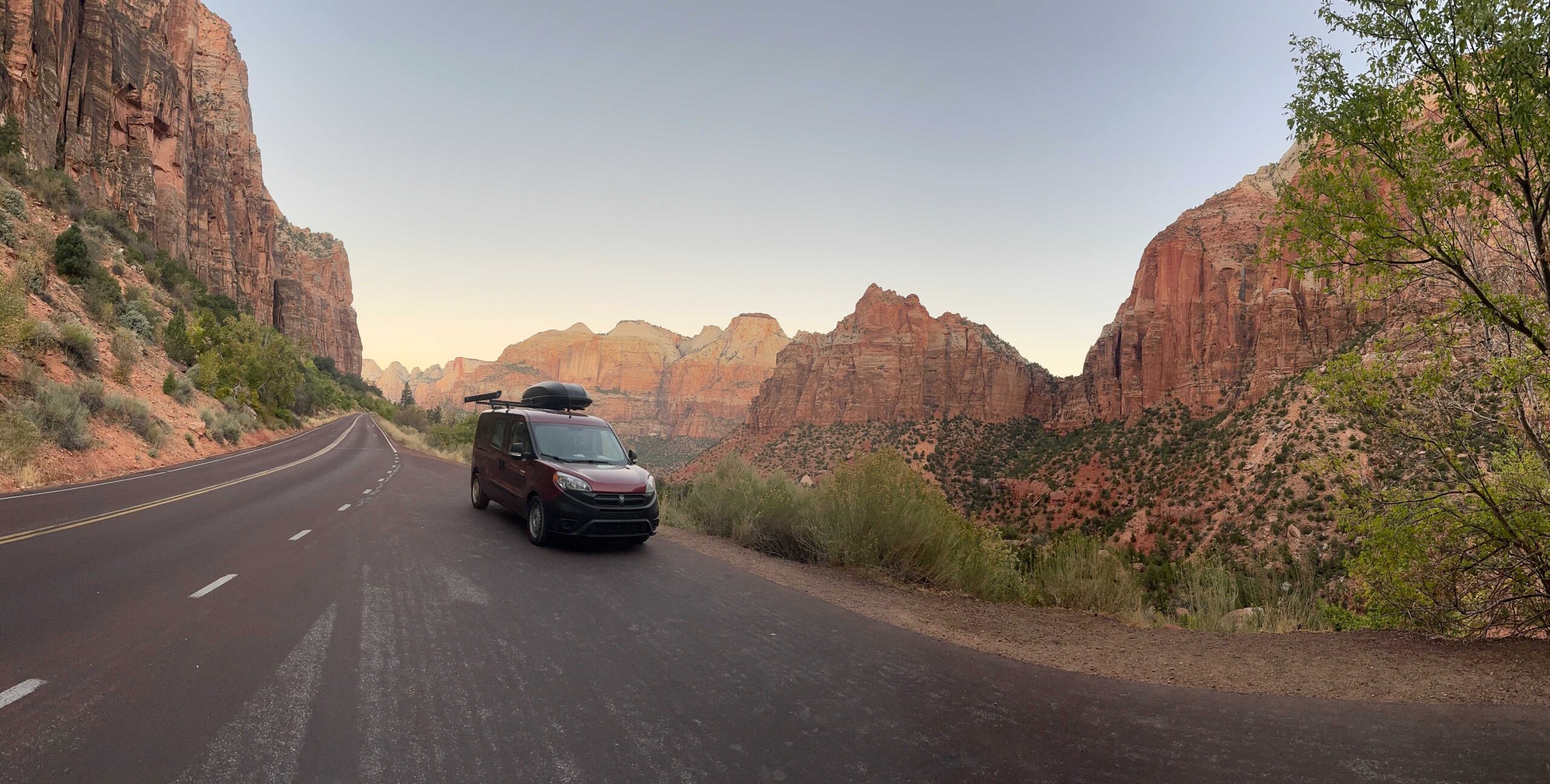 Camper van driving through Zion National Park on Mt. Carmel Highway